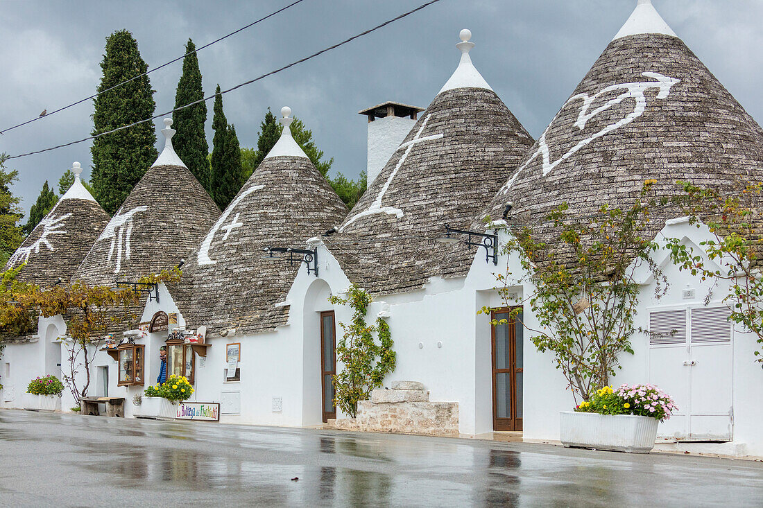 The traditional huts called Trulli built with dry stone with a conical roof Alberobello province of Bari Apulia Italy Europe