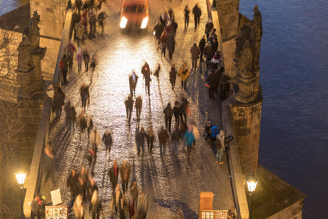 People on the historical Charles Bridge on Vltava , Moldava  river Prague Czech Republic Europe