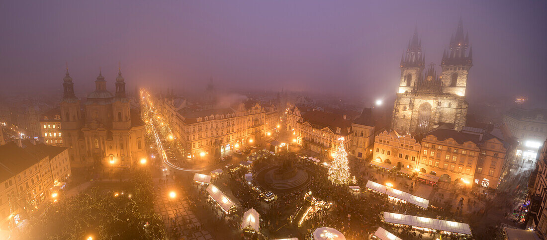 Panorama of Christmas Markets and Cathedral of Saint Vitus surrounded by fog Old Town Square Prague Czech Republic Europe