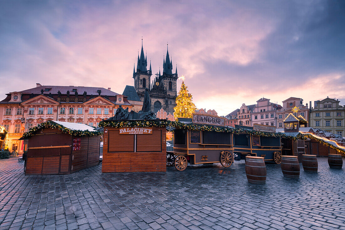 The Church of Saint Mary of Tyn photographed at dawn, in the foreground Christmas stalls, Prague, Czech Republic