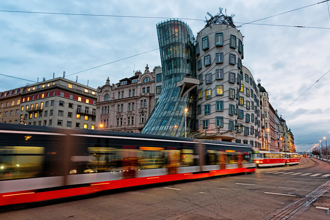 The famous Tancici dum, in the modern district of Prague, photographed with moving bus, Tancici dum, Prague, Czech Republic