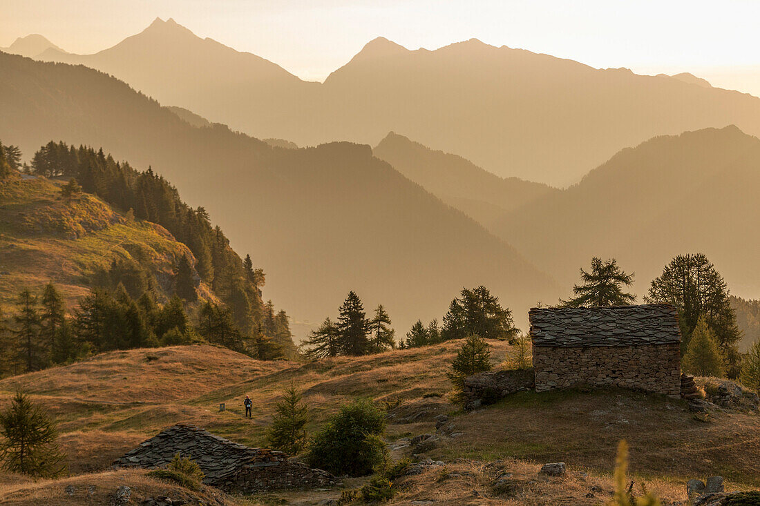 Old alp in the high valley of Champorcher at sunrise, Aosta Valley, Italy, Europe