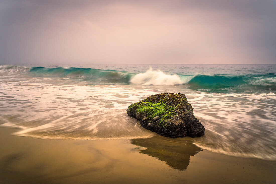 Waves Crash Around A Rock In Southern California