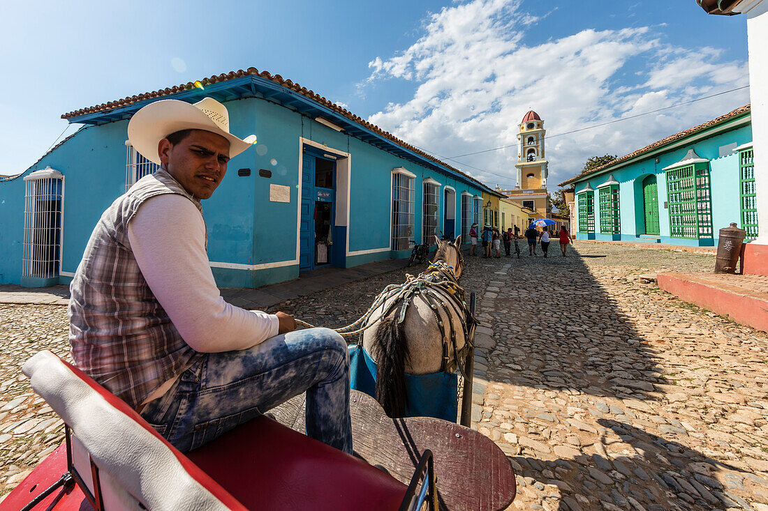 A horse-drawn cart known locally as a coche in Plaza Mayor, in the town of Trinidad, UNESCO World Heritage Site, Cuba, West Indies, Caribbean, Central America