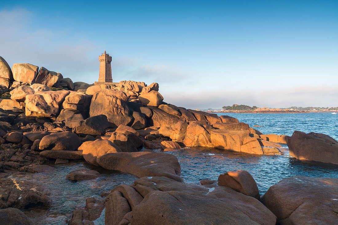 Morning light on Ploumanach lighthouse, Perros-Guirec, Cotes-d'Armor, Brittany, France, Europe