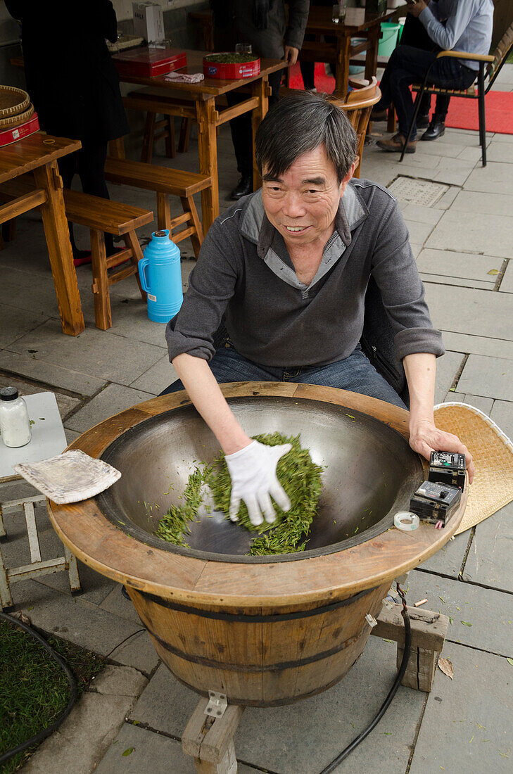 Drying tea near Lingyin Temple, Hangzhou, Zhejiang province, China, Asia