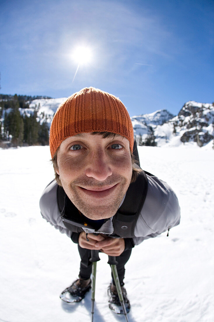 Young man snowshoeing near Lake Tahoe, California.    (release code: 050.jpg)