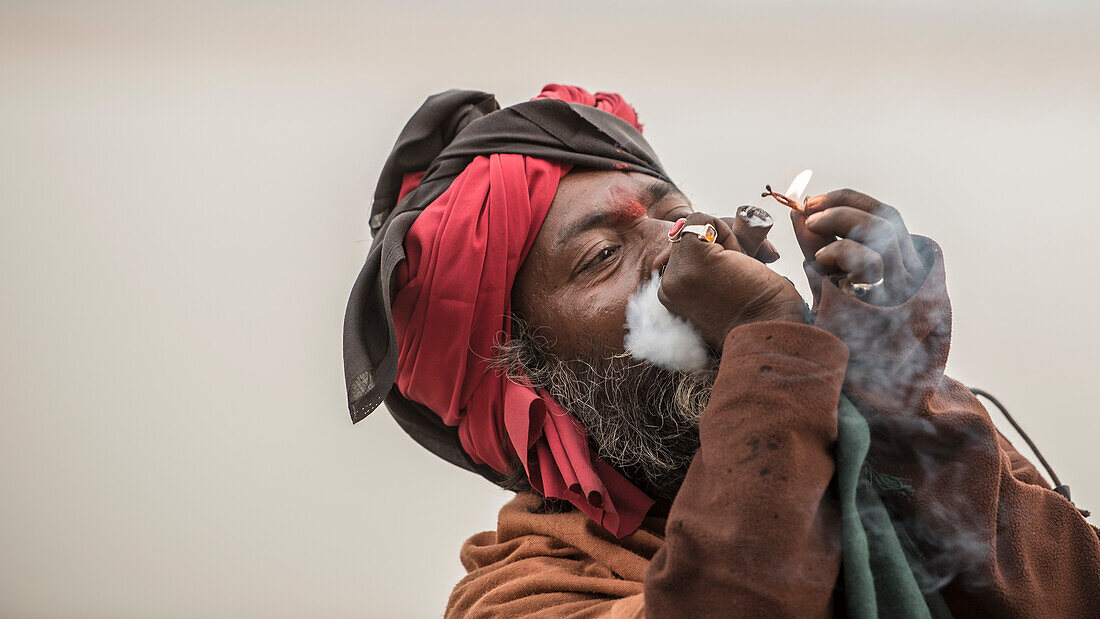 A babba smokes a chillum in Varanasi, India.