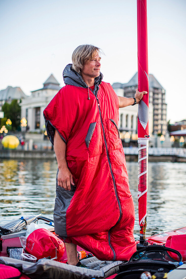 A Man Standing On His Kayak In Victoria, Canada