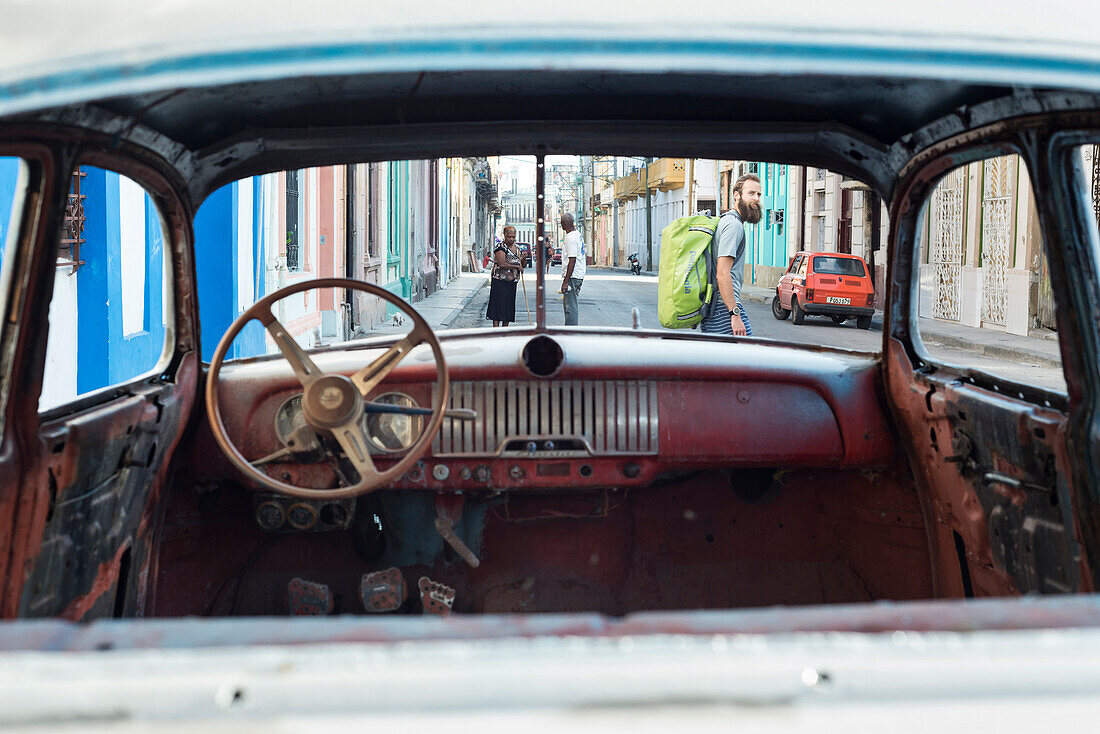 A man takes the road less traveled on the way to the bus station, Havana, Cuba.