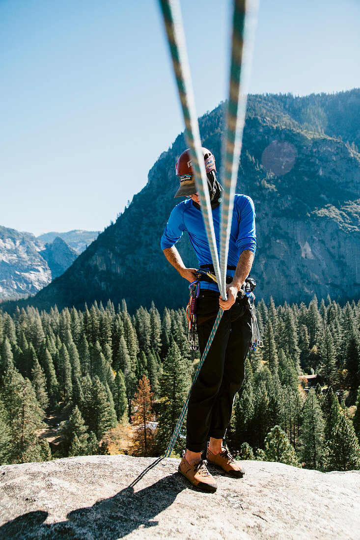 A climber at the top of Pitch 3 on Swan Slab Gully (5.6) in Yosemite.