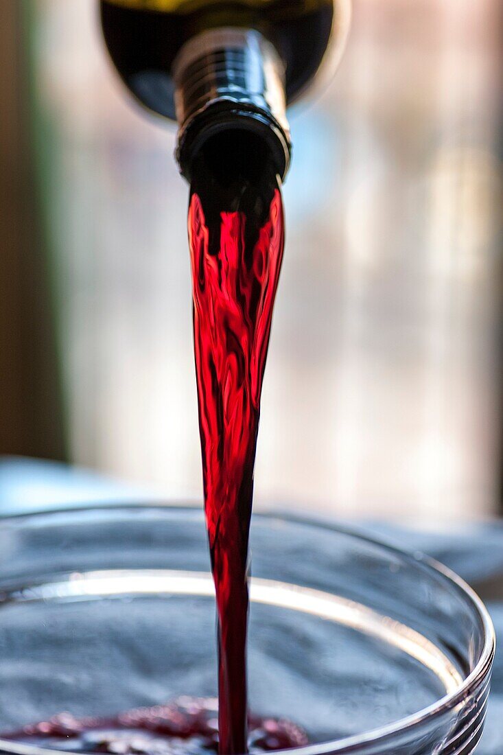 Pouring red wine