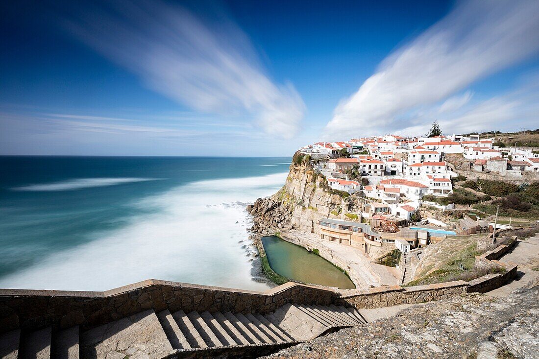 Top view of the perched village of Azenhas do Mar surrounded by the blue water of the Atlantic Ocean Sintra Portugal Europe