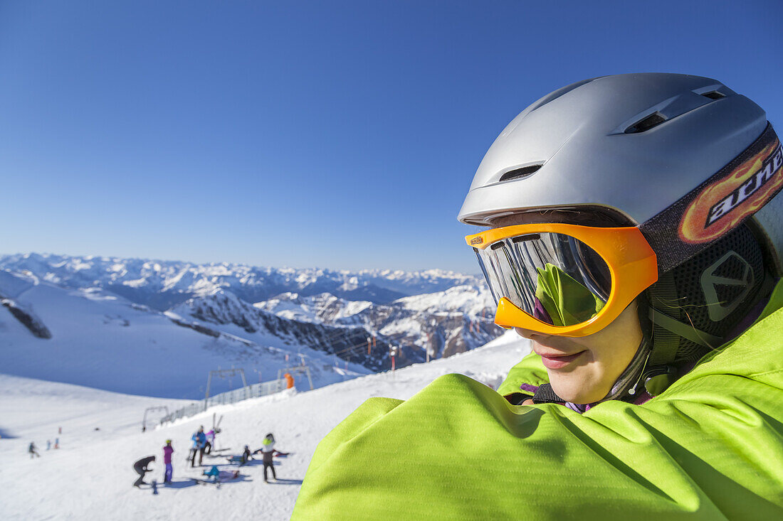 Girl making a break of skiing on the glacier Hintertuxer Gletscher, Hintertux, Zillertal, Tirol, Austria, Europe