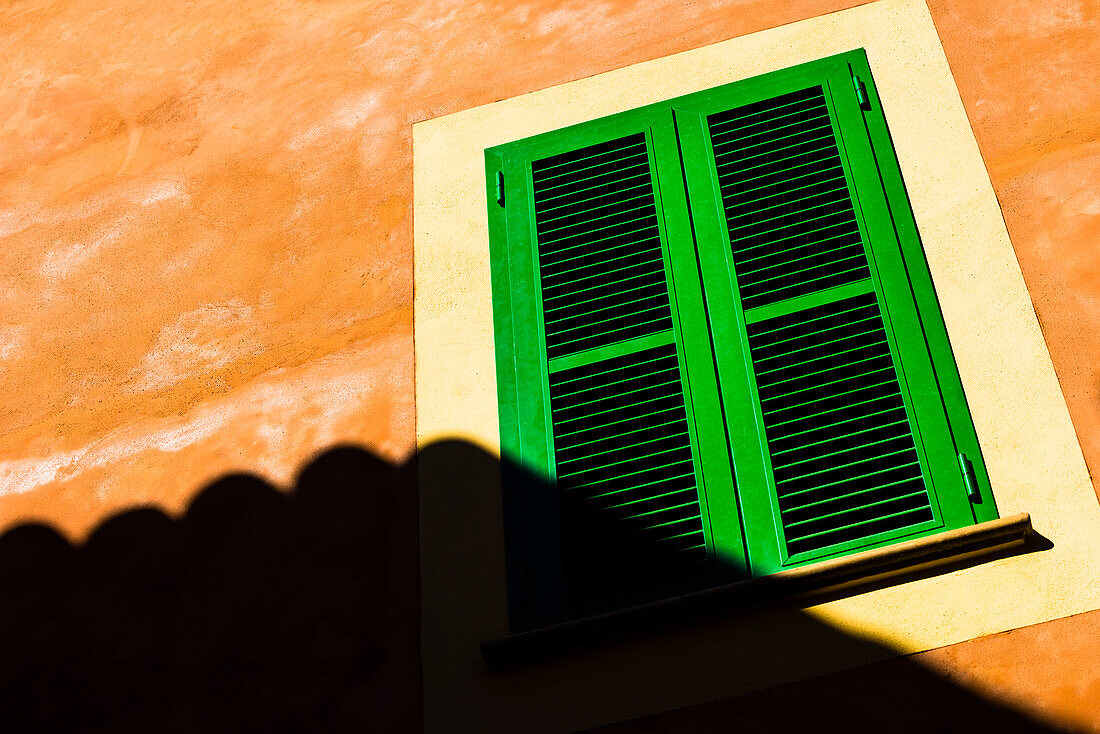 Shadow of the neighbouring house on a house wall in the old town, Valldemossa, Mallorca, Spain