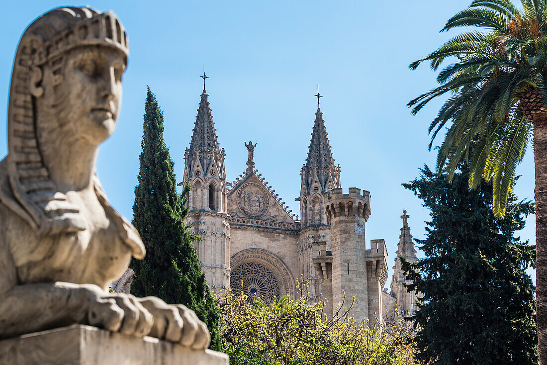 View of the boulevard Passeig del Born with a sphinx figure in the foreground at the cathedral, Palma de Mallorca, Mallorca, Spain