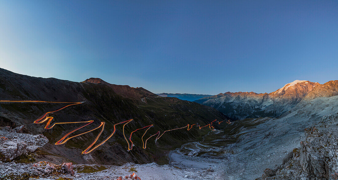 Panorama of lights of car trace at dusk, Stelvio Pass, Valtellina, Lombardy, Trentino Alto Adige, Italy, Europe