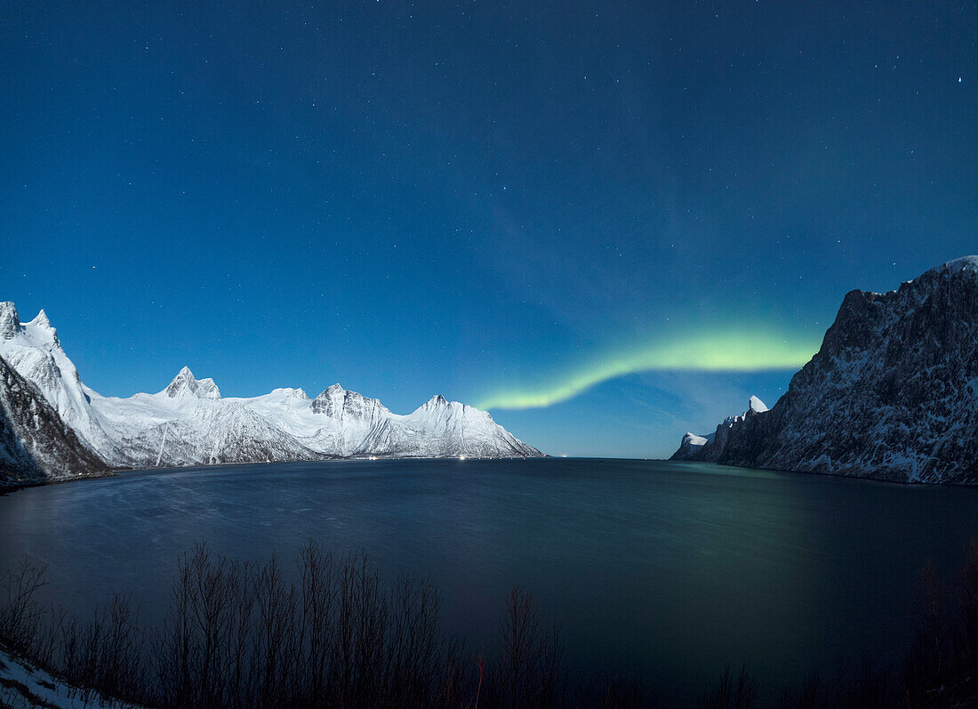 Panorama of the Northern Lights on the Senjahopen peak surrounded by the frozen sea, Senja, Mefjordbotn, Troms county, Norway, Scandinavia, Europe