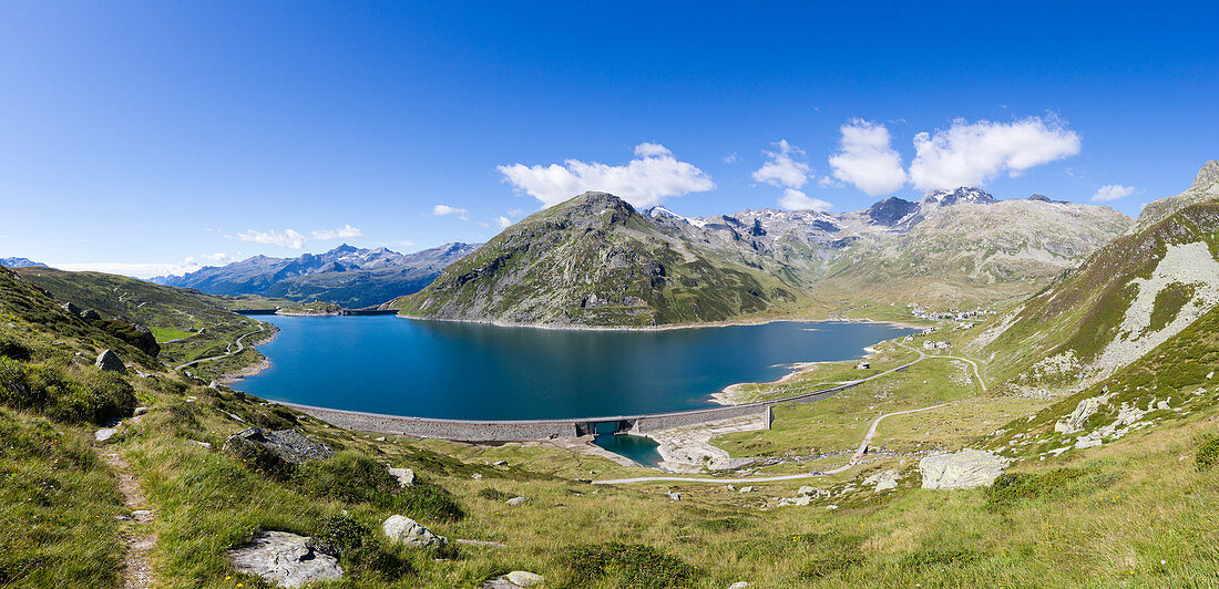 Panorama of the blue Lake Montespluga surrounded by rocky peaks in summer, Chiavenna Valley, Valtellina, Lombardy, Italy, Europe