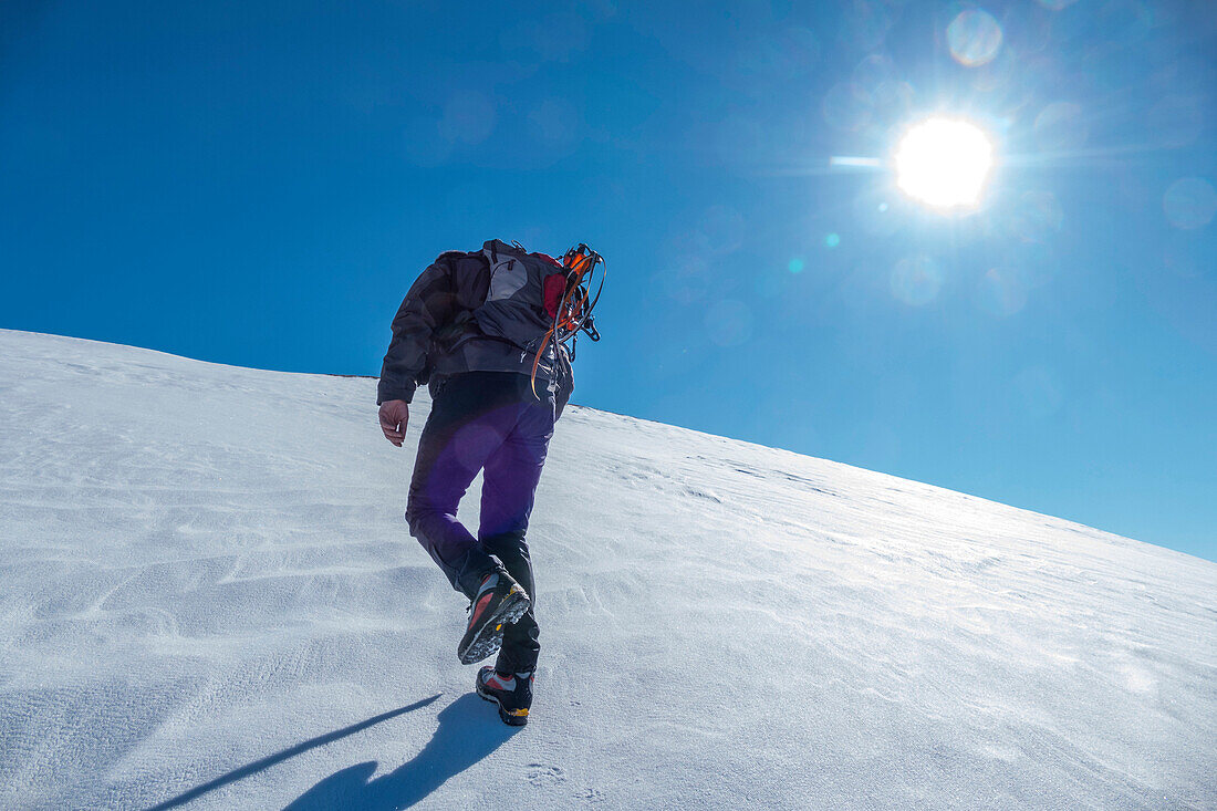 Hiker on mountain Vettore in winter, Sibillini National Park, Umbria, Italy, Europe