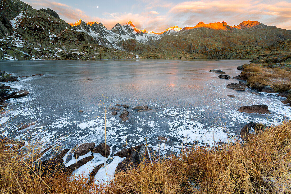 Italy, Trentino Alto Adige, Adamello Brenta Park, Nambrone valley, Dawn at Black Lake, in background Presanella group sunlit