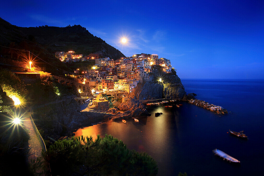 View of Manarola village by night, cinque terre, La Spezia district, Liguria, Italy