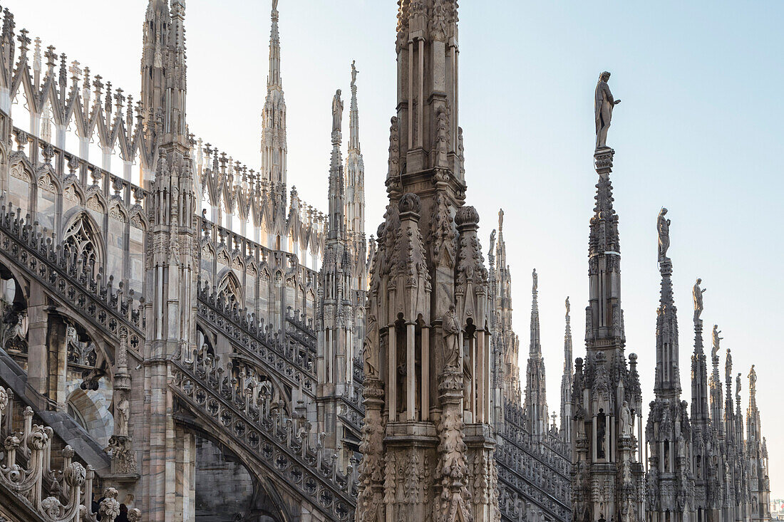 On the rooftop of the Duomo di Milano, among the white marble spiers, Milano, Lombardy, Italy