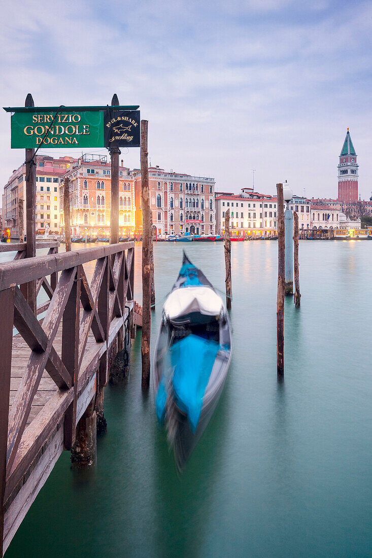 Europe, Italy, Veneto, Venice, The iconic venetian gondola on the Grand Canal at dawn