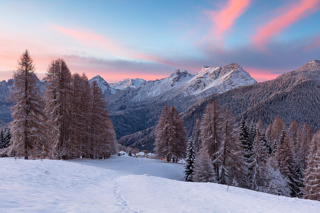 Europe, Italy, Veneto, Belluno, Dolomites, Colorful sunrise over the village of Coi, Zoldo valley