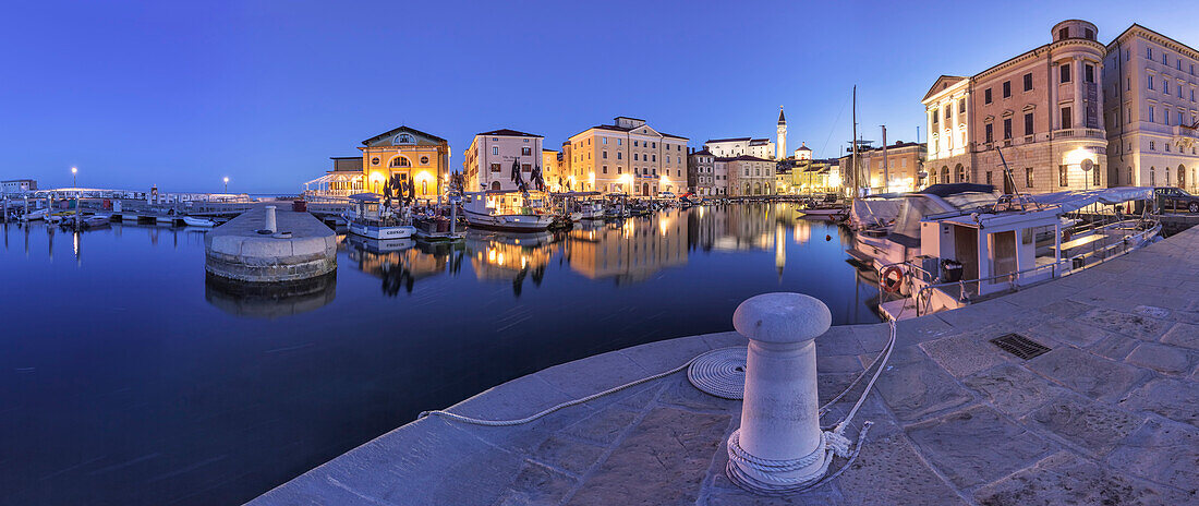 Europe, Slovenia, Istria, Piran, The picturesque port and the buildings around it at dusk