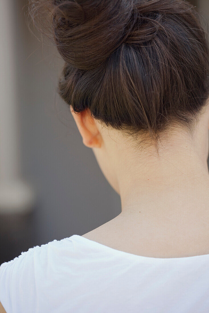 Head and Shoulders Portrait of Woman with Hair Pulled Up, Rear View