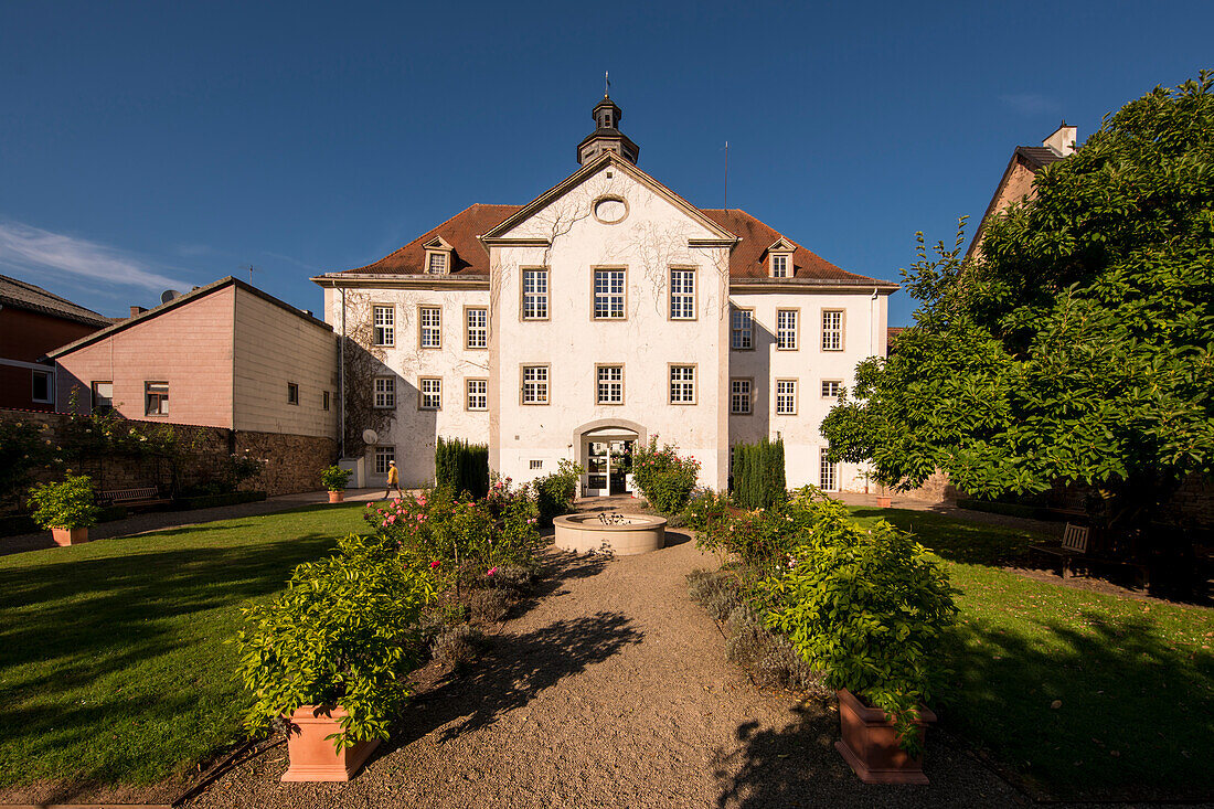 Rose garden behind the town hall, a former packing and warehouse, Bad Karlshafen, Hesse, Germany, Europe