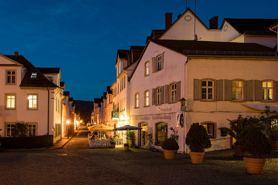 Historic road with houses in Baroque style from the time of the first settlement of the Huguenots at dusk, Bad Karlshafen, Hesse, Germany, Europe
