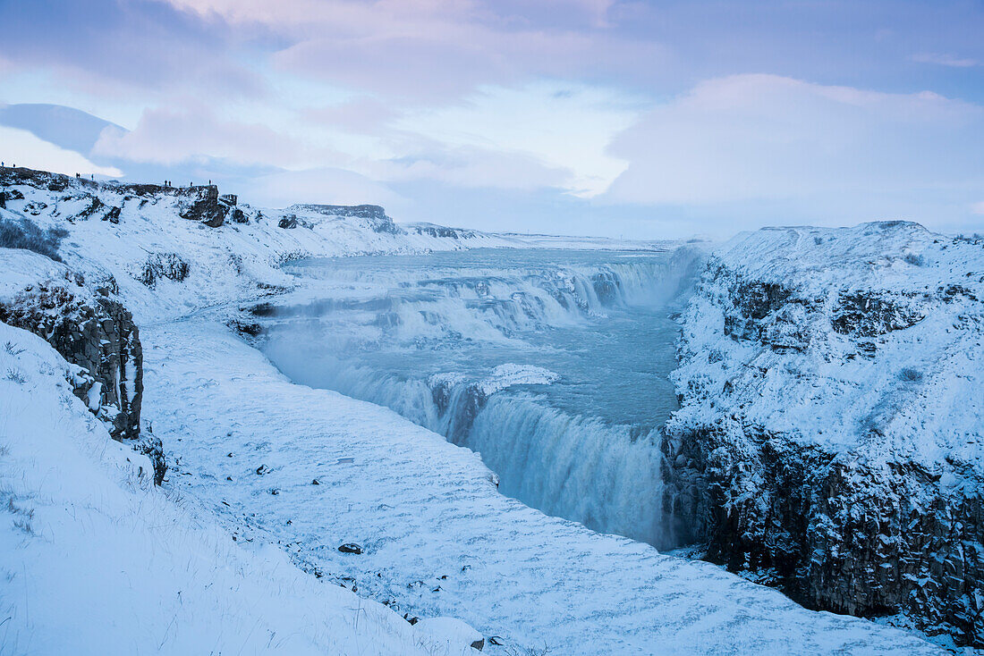 The Gullfoss Falls waterfall on the river Hvítá (Hvita) in snowy landscape in winter, Gullfoss, Gullfossi, Vesturland, Iceland, Europe