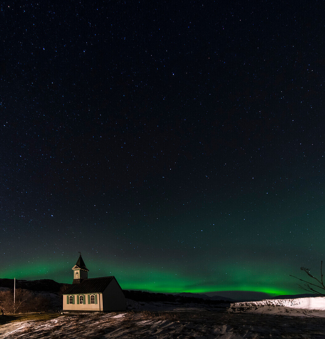 Aurora borealis (Northern Lights) and pingvallakirkja Church at Thingvellir National Park (pingvellir National Park) in winter at night, Pingvellir National Park, Sudurland, Iceland, Europe