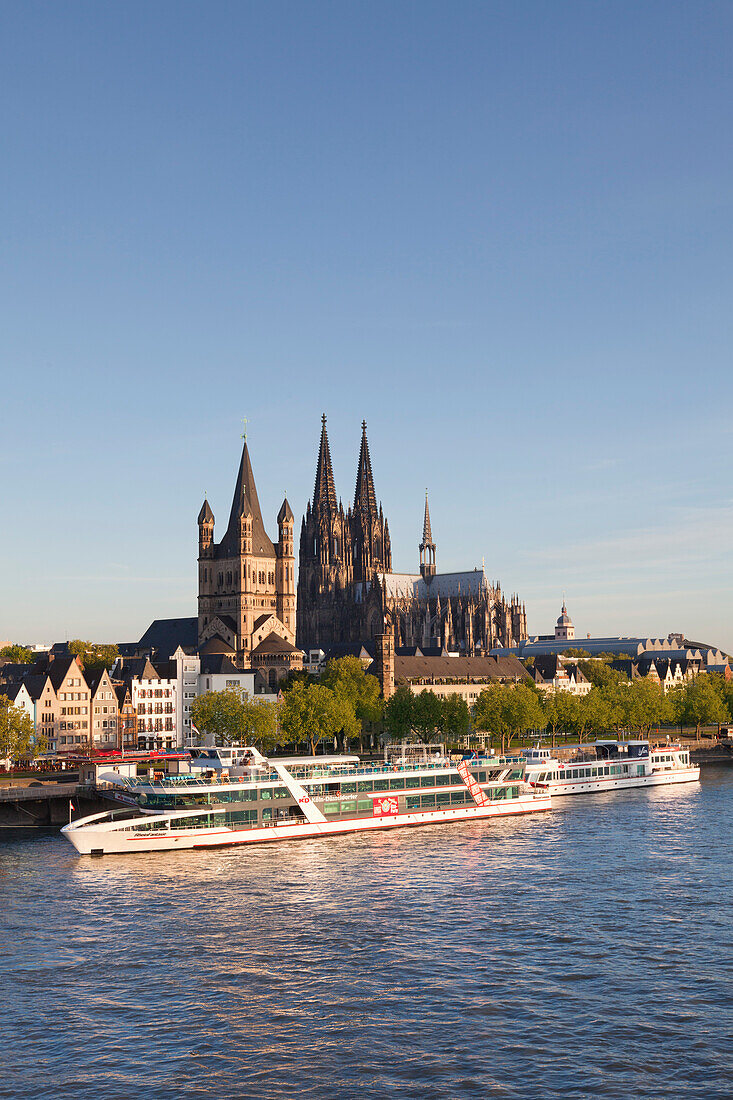 View over the Rhine river to the Old town with Gross-St Martin and Cologne cathedral, Cologne, North Rhine-Westphalia, Germany