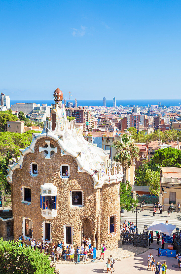 Casa del Guarda lodge by Antoni Gaudi at Parc Guell, UNESCO World Heritage Site, with a skyline view of the city of Barcelona, Catalonia (Catalunya), Spain, Europe
