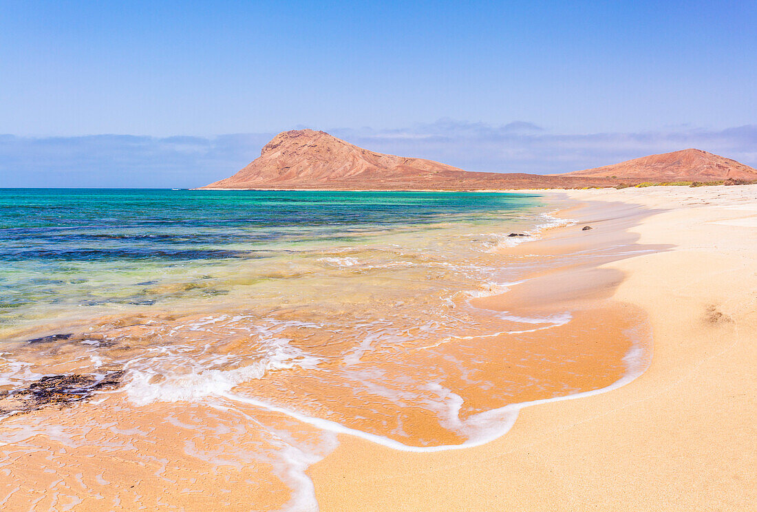 Empty sandy beach and bay near Monte Leao mountain (Sleeping Lion mountain), Sal Island, Cape Verde, Atlantic, Africa