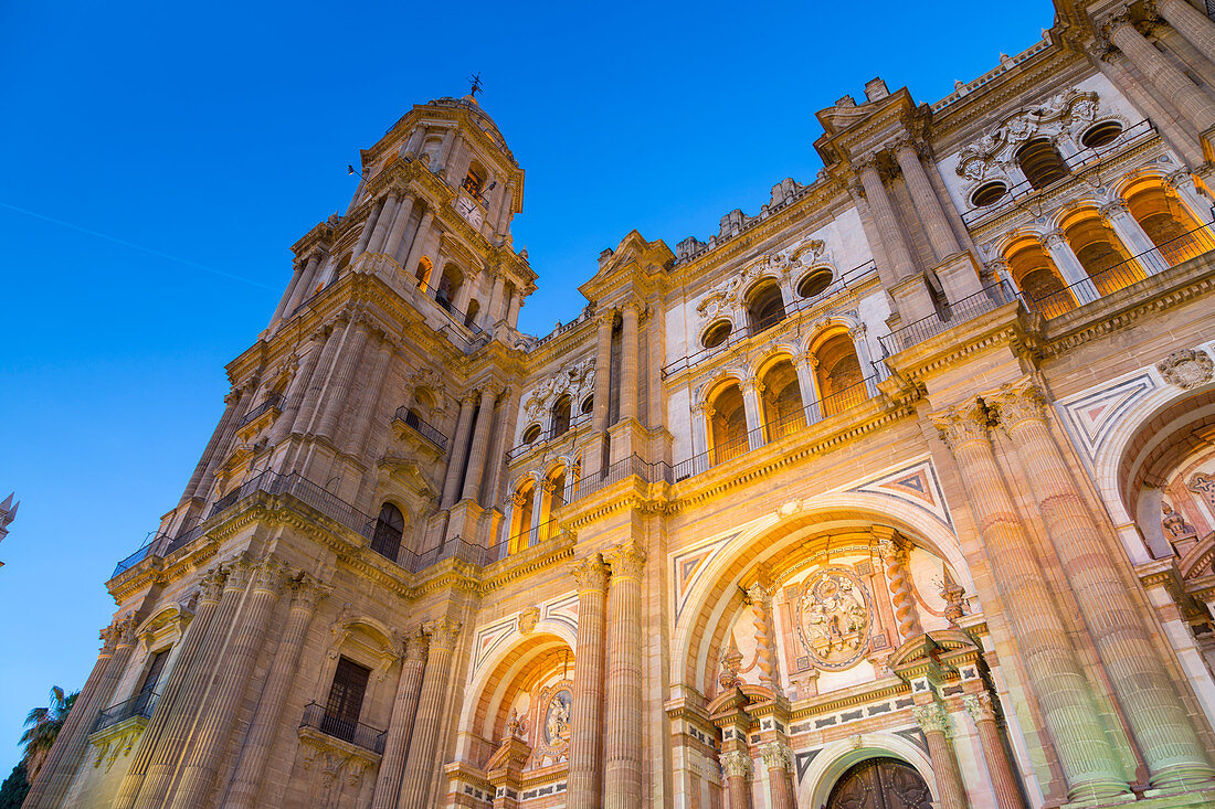 View of Cathedral in Plaza del Obispo at dusk, Malaga, Costa del Sol, Andalusia, Spain, Europe