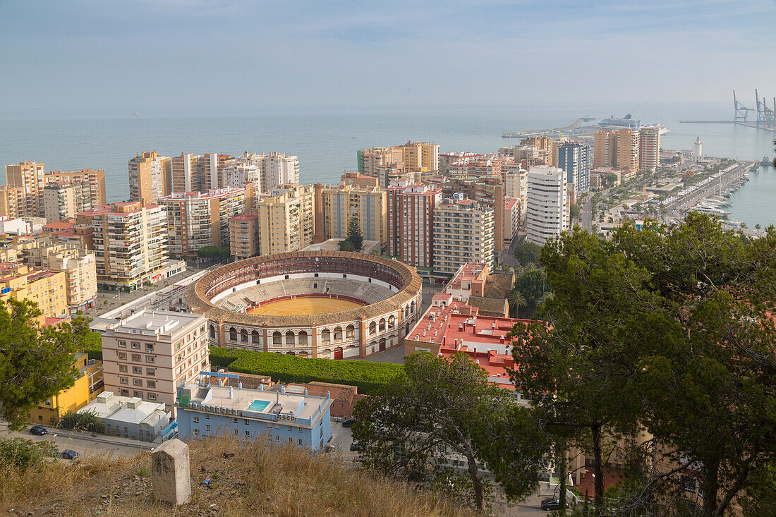 View of Plaze de Toros and harbour from the ruins of the Moorish castle fortress high atop Mount Gibralfaro, Malaga, Costa del Sol, Andalusia, Spain, Europe