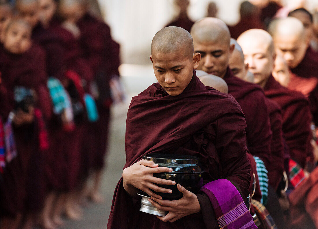 Novice Buddhist monks returning to monastery for their breakfast, Amarapura, Mandalay, Mandalay Region, Myanmar (Burma), Asia