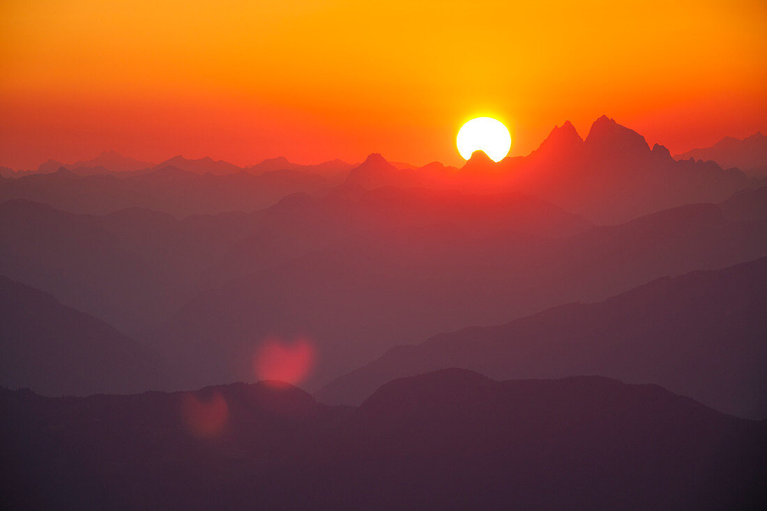 The sun sets behind Mount Judge Howay as seen from Chilliwack, British Columbia, Canada.