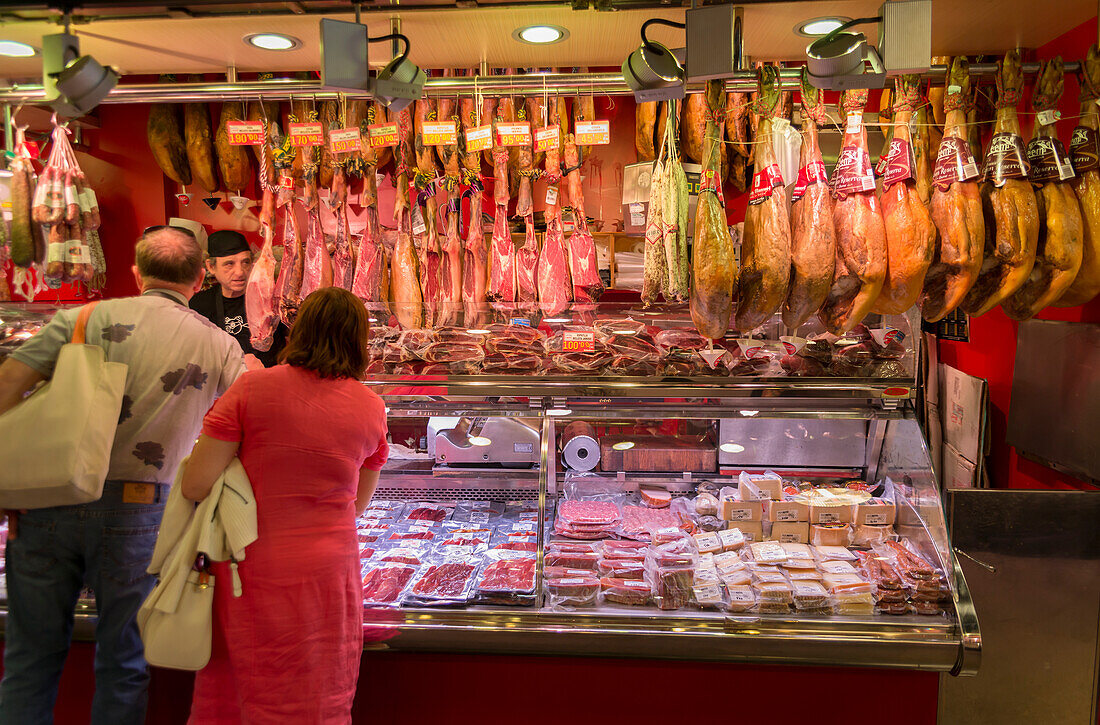 'A couple shops at Boqueria Market, one of the most famous markets around Spain and the most famous in Barcelona; Barcelona, Catalonia, Spain'