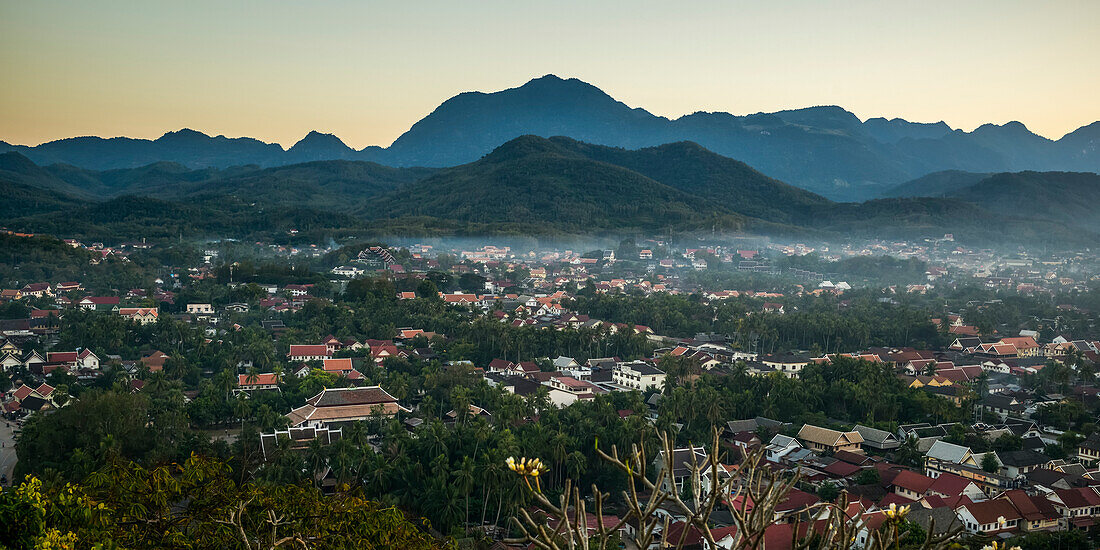 'Silhouette of mountains and the view from Mount Phousi; Luang Prabang, Luang Prabang Province, Laos'