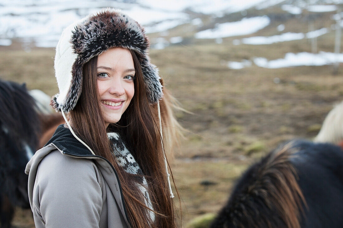 'Icelandic Woman Standing With An Icelandic Horse; Iceland'