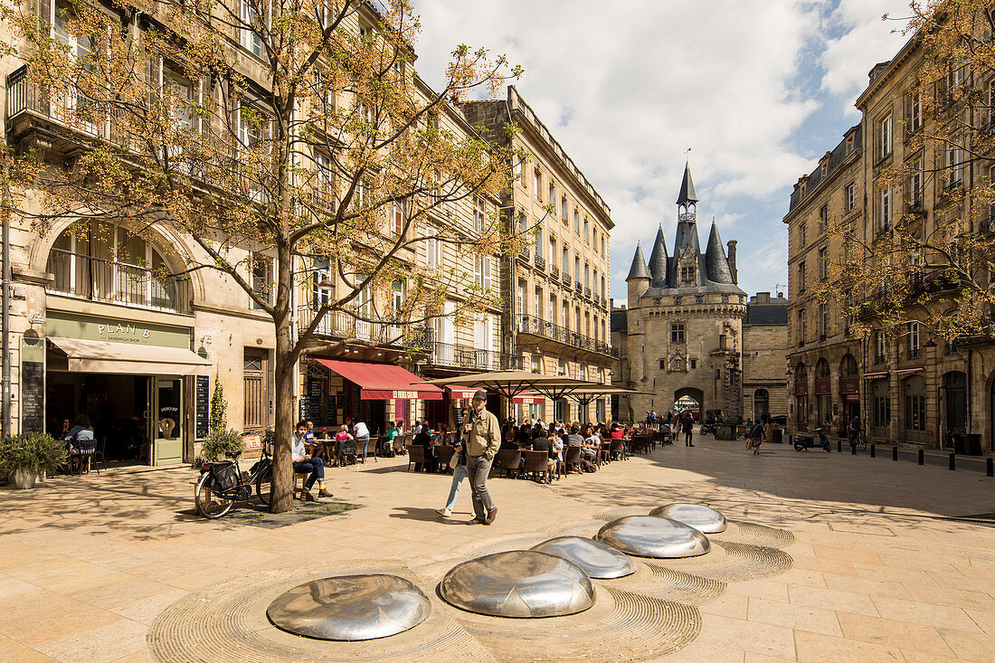 Place du Palais with restaurants and views of the Porte Cailhau city gate