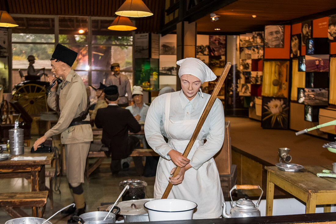 'Statues of men and women working as exhibits in a museum; Haifa, Haifa District, Israel'