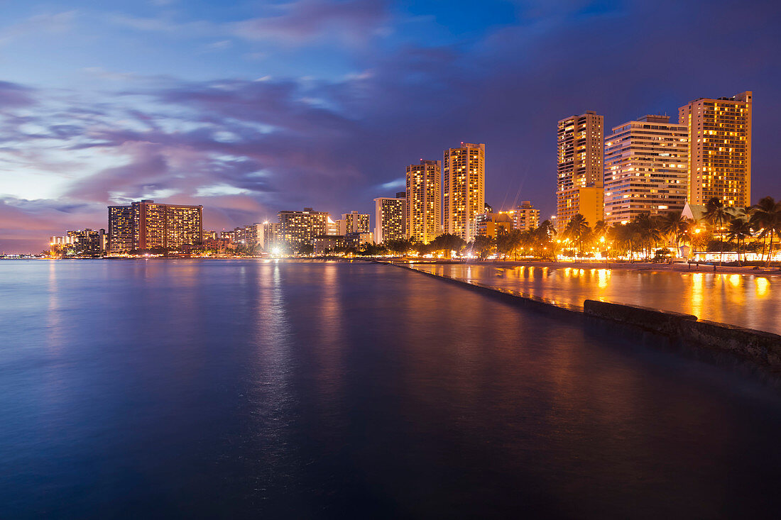 'Skyline view of Waikiki in long exposure at sunset; Honolulu, Oahu, Hawaii, United States of America'