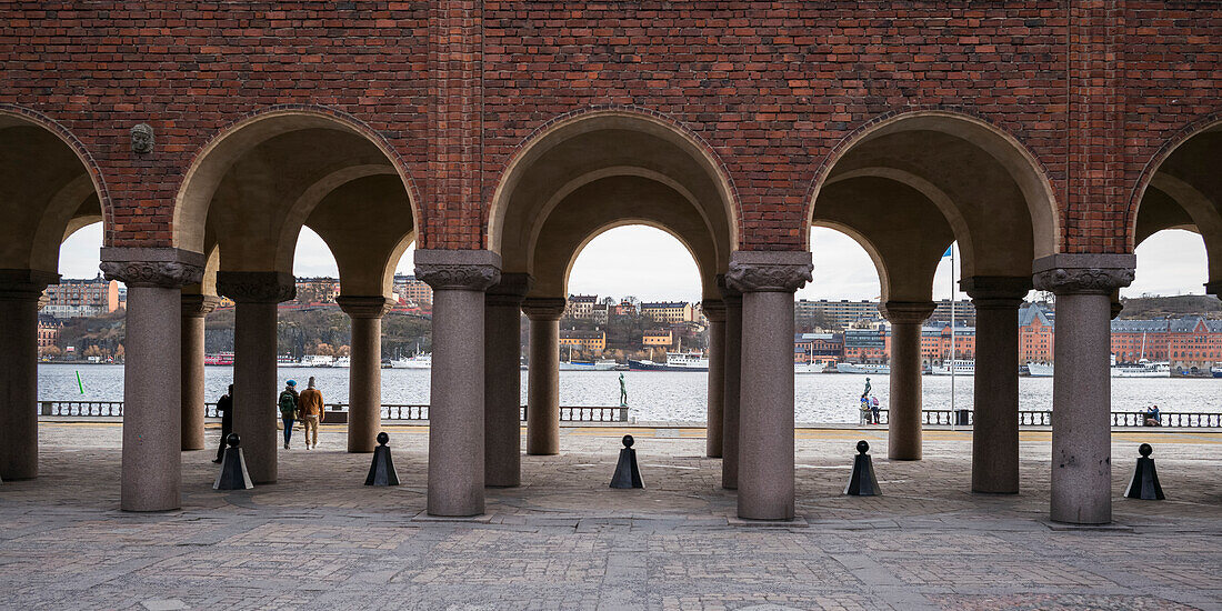 'A brick wall with arches and pillars, Stockholm City Hall; Stockholm, Sweden'