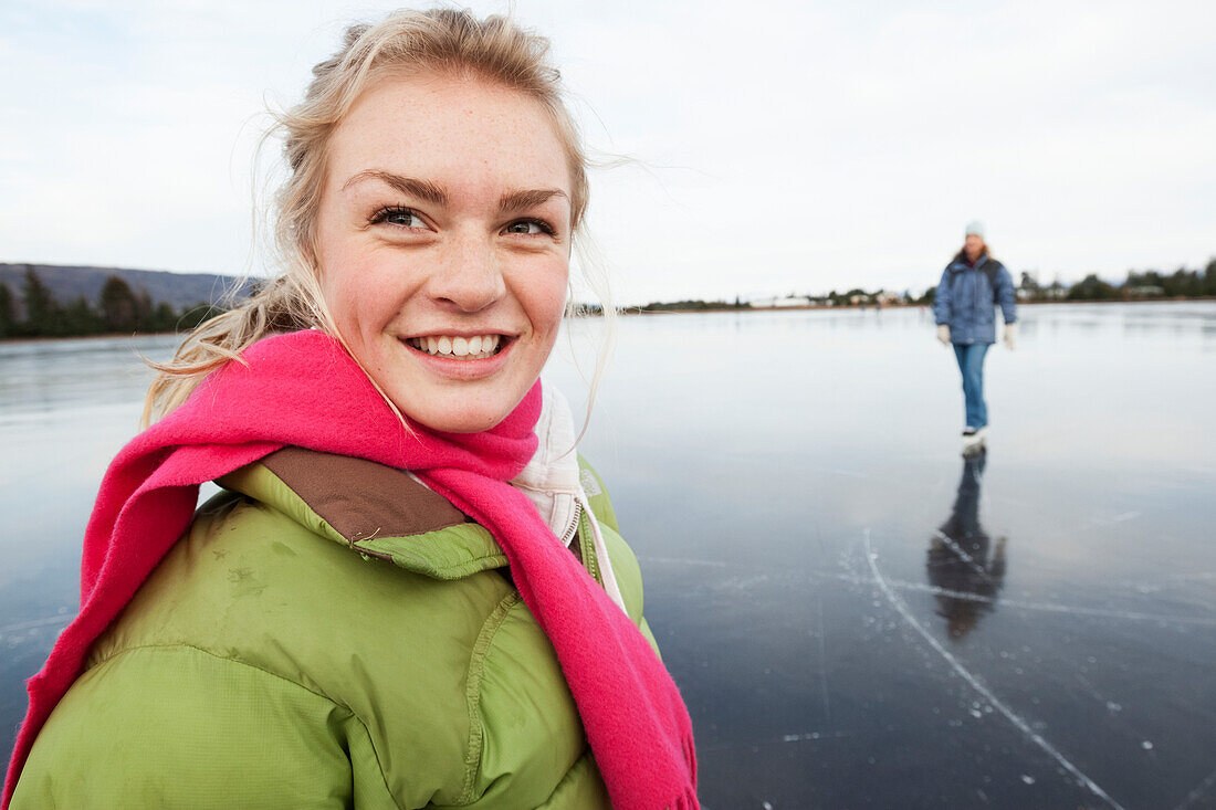 Ice skating on a frozen lake, Alaska, United States of America